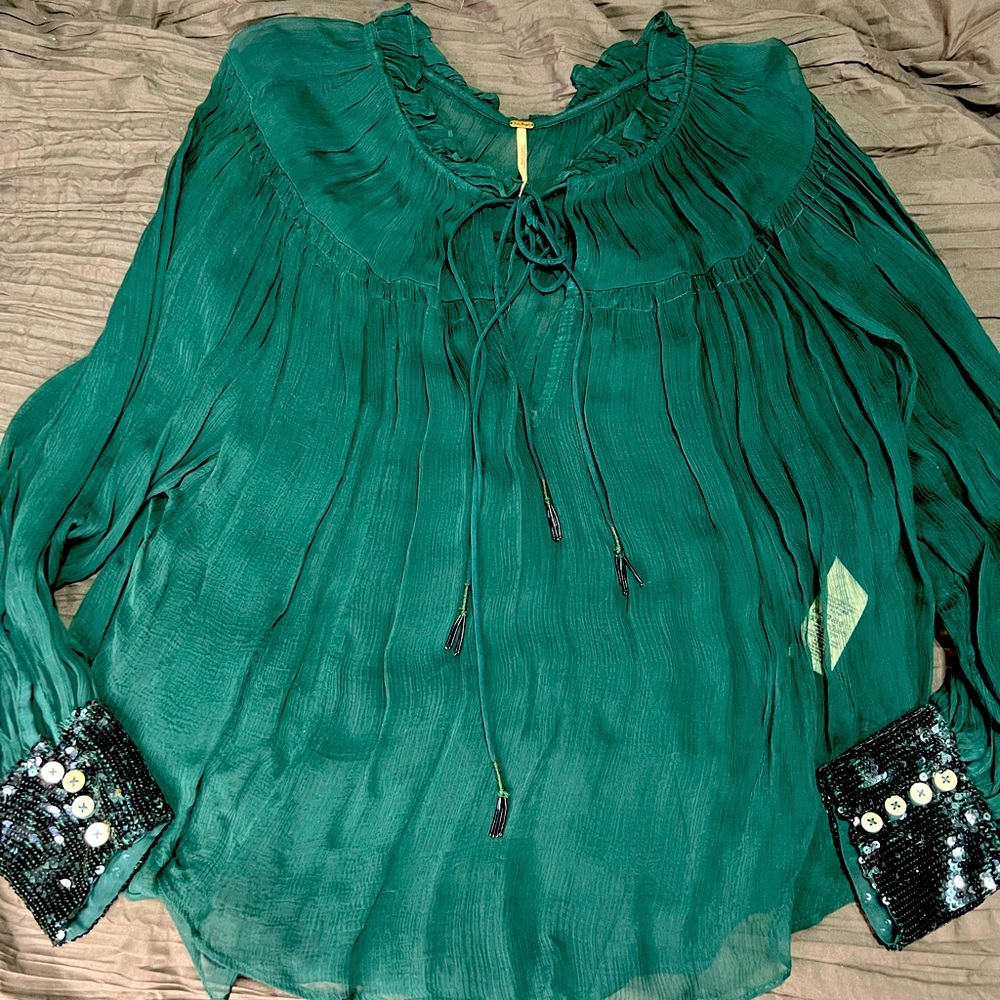 Free people beautiful sheer blouse with sequin cuff.  Xs